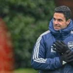 Arsenal manager Mikel Arteta addressing his players during a Premier League training session, emphasizing focus and handling pressure.