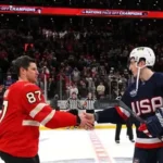 Canadian and American ice hockey players in action at Milano-Cortina 2026 Winter Olympics.