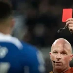 Chelsea head coach Liam Rosenior giving instructions to his players during a Premier League match, emphasizing discipline and focus