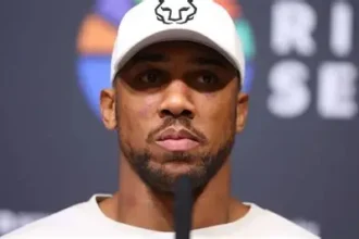 Anthony Joshua walking with his team outside Lagos court