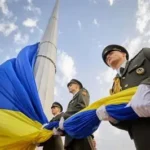 Ukrainian female soldier in uniform at frontline position after four years of war