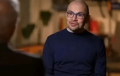 Google DeepMind CEO Sir Demis Hassabis speaking at the AI Impact Summit in Delhi, discussing AI risks and regulation.