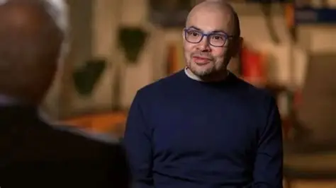 Google DeepMind CEO Sir Demis Hassabis speaking at the AI Impact Summit in Delhi, discussing AI risks and regulation.