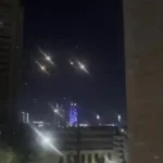 Missile debris falling into a residential area in Doha after interception