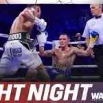 Leigh Wood celebrates his unanimous decision victory over Josh Warrington in Nottingham's Motorpoint Arena while Warrington looks on, exhausted.
