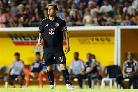 Lionel Messi on the ground after pitch invader incident during Inter Miami match