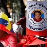Venezuelan political prisoners and their families demonstrate outside a prison in Caracas after a new amnesty law was passed.