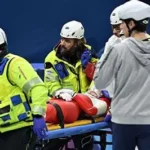 Polish short track skater Kamila Sellier lying on a stretcher after a crash at Milan-Cortina 2026.