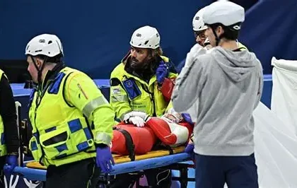 Polish short track skater Kamila Sellier lying on a stretcher after a crash at Milan-Cortina 2026.