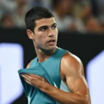 Carlos Alcaraz storms to a 50-minute victory over Arthur Fils to win the Qatar Open, extending his unbeaten 2026 streak.