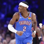 Shai Gilgeous-Alexander driving to the basket during Thunder vs Nuggets game