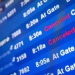 Airport departures board showing cancelled Middle East flights amid regional conflict