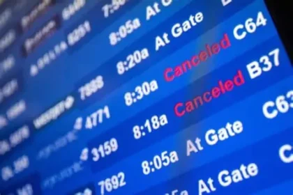 Airport departures board showing cancelled Middle East flights amid regional conflict