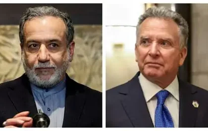 US and Iranian flags displayed during diplomatic meeting