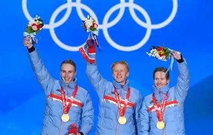 Norwegian athletes celebrating gold medals at the 2026 Winter Olympics