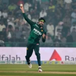 Pakistan off-spinner Usman Tariq delivering a ball during T20 World Cup, showing his distinctive pause in the bowling stride.