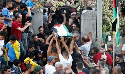 Funeral for members of the Bani Odeh family in Tammun, West Bank.
