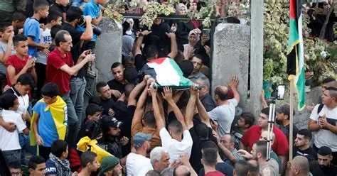 Funeral for members of the Bani Odeh family in Tammun, West Bank.