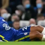 Chelsea captain Reece James reacts after suffering a hamstring injury during a match.