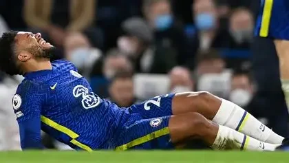 Chelsea captain Reece James reacts after suffering a hamstring injury during a match.