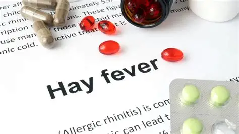 Person suffering from hay fever symptoms like sneezing and watery eyes outdoors