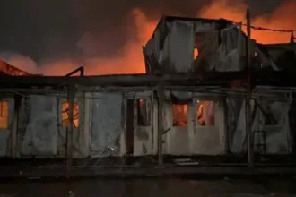 Emergency responders at a Kabul drug rehabilitation hospital after an air strike.
