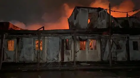 Emergency responders at a Kabul drug rehabilitation hospital after an air strike.