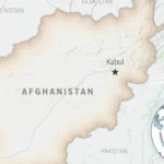 Dennis Coyle after release in Kabul with officials