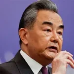 Australian businessman leaving court after foreign interference conviction.