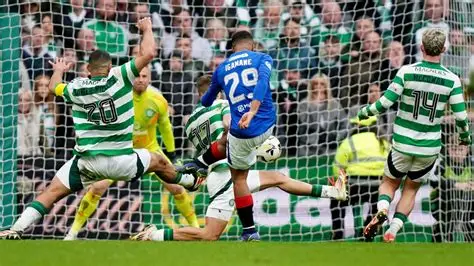 Celtic players celebrate after beating Rangers in Scottish Cup penalty shootout