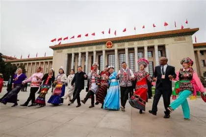Chinese President Xi Jinping attending the National People's Congress meeting discussing the ethnic unity law
