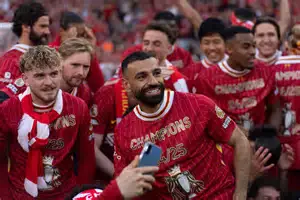 Jonny Clayton celebrating after defeating Luke Humphries in the Premier League darts final in Nottingham.