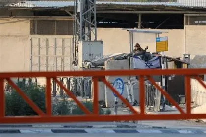 Palestinian villagers stand near the site where a man was killed during a settler attack in the West Bank.