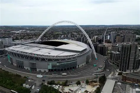 Fans entering Wembley Stadium during a football match with enhanced security checks