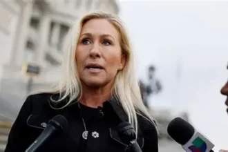 Campaign signs for Marjorie Taylor Greene in Georgia office