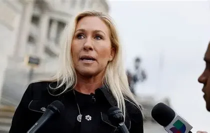 Campaign signs for Marjorie Taylor Greene in Georgia office