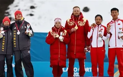 German Paralympic skiers turn away during the Russian national anthem at the medal ceremony.