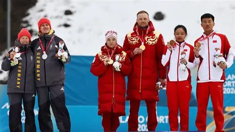 German Paralympic skiers turn away during the Russian national anthem at the medal ceremony.