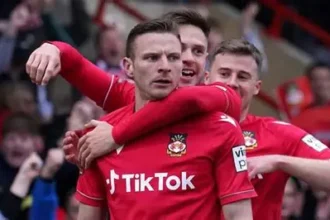 David Brooks celebrating with Wales jersey after overcoming cancer