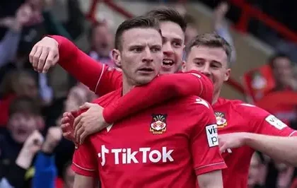 David Brooks celebrating with Wales jersey after overcoming cancer