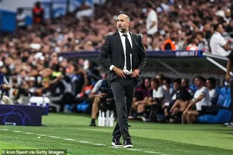 Igor Tudor directing Tottenham players during Premier League match, emphasizing defensive shape