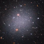 Hubble telescope image showing faint dark galaxy CDG-2 with globular clusters