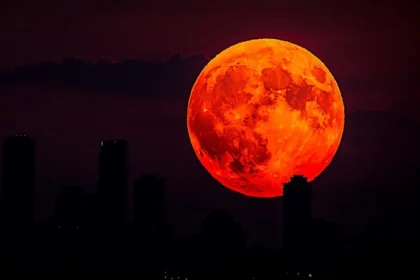 Total lunar eclipse turning the moon red during the blood moon event