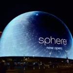 Interior view of immersive dome entertainment venue with giant curved screen