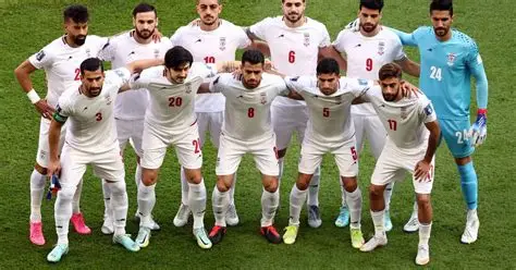 Iran players sing and salute national anthem before Asian Cup match against Australia