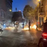 Smoke rising over Tehran skyline after airstrikes
