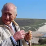 King Charles walking along England Coast Path near Seven Sisters cliffs