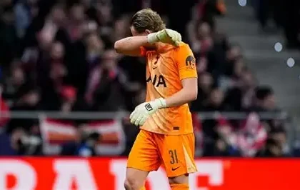 Tottenham goalkeeper Antonin Kinsky walking off the pitch after early substitution against Atletico Madrid