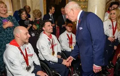 Pickle the guide dog with Hester Poole at ParalympicsGB House in Cortina