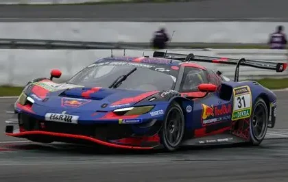 Max Verstappen driving a Mercedes AMG GT on a racetrack